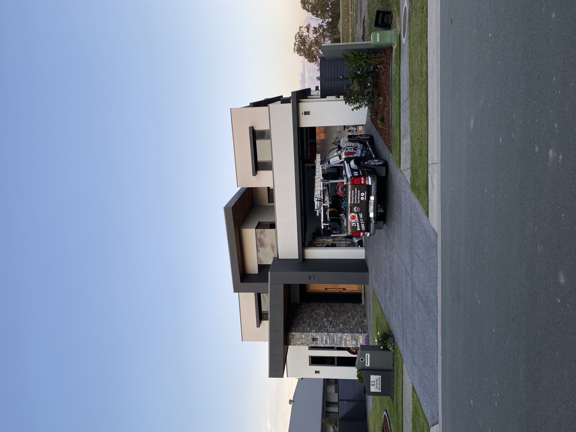 Zen Window Cleaning branded ute parked on the driveway of a modern Gold Coast home, ready for the job