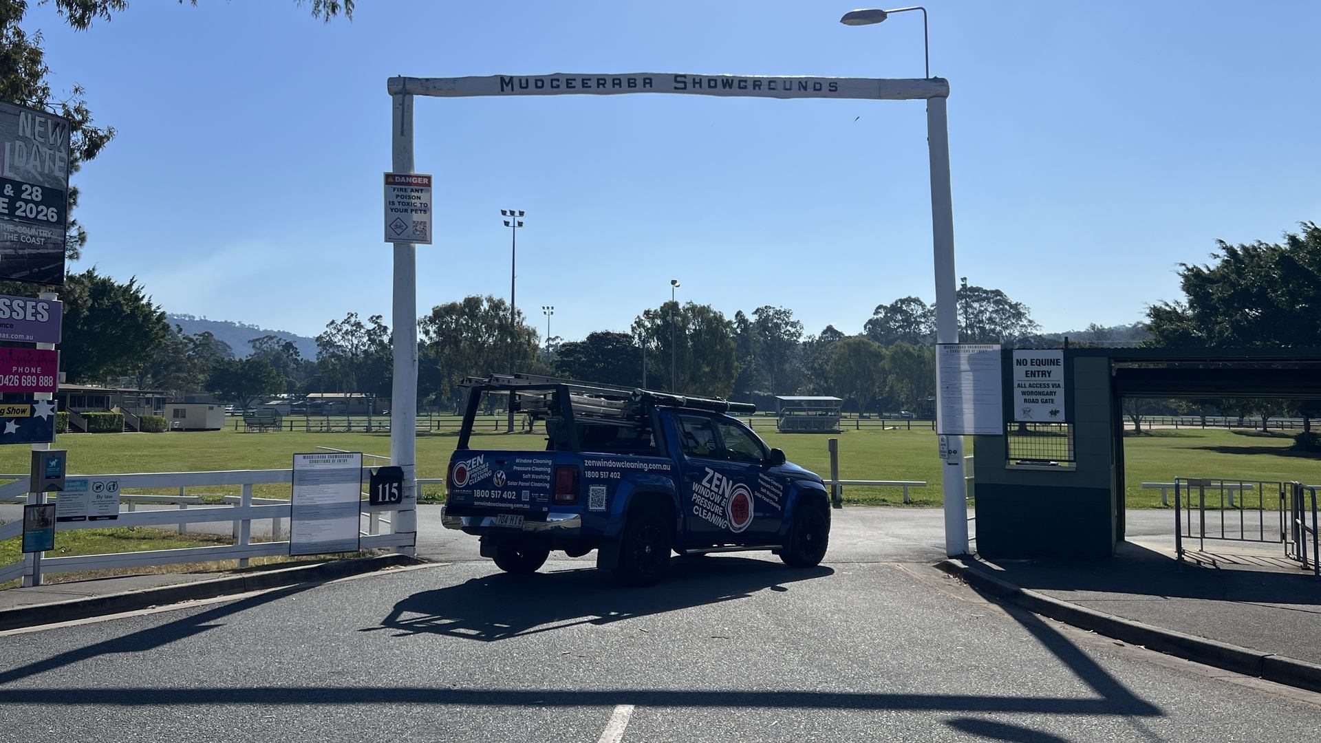 Zen Window Cleaning ute under the Mudgeeraba Showgrounds entrance arch, on the Worongary border